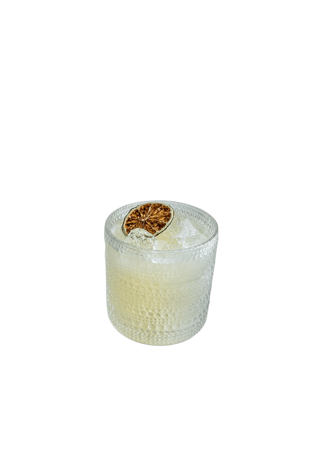 House Margarita in a textured rocks glass with a dried lime wheel
