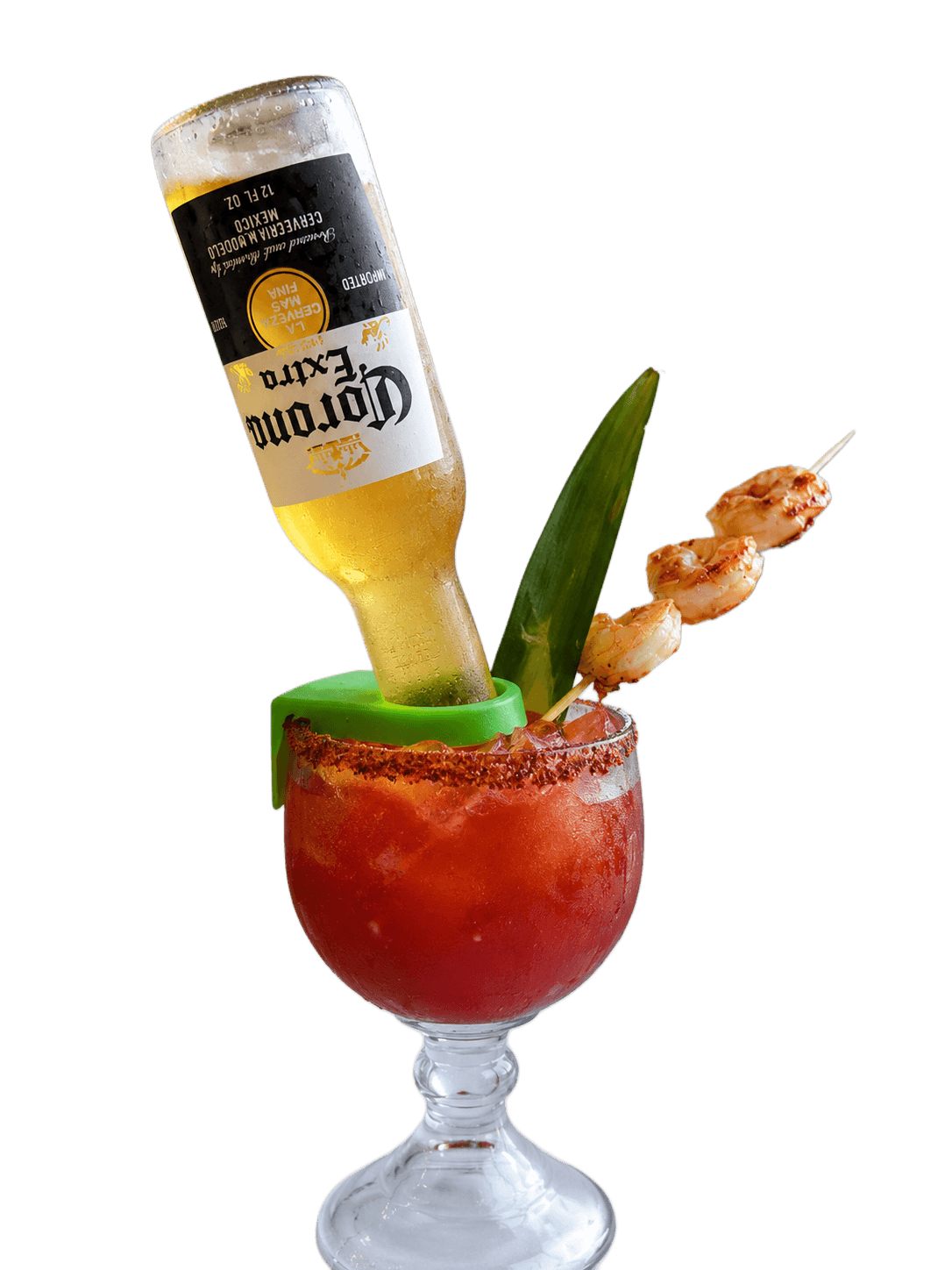 A michelada served in a clay cup, salted rim, with tamarind candy and lime